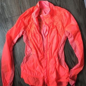 Lululemon wind breaker; neon coral, size 6